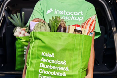 Instacart Employee with Groceries in Hand