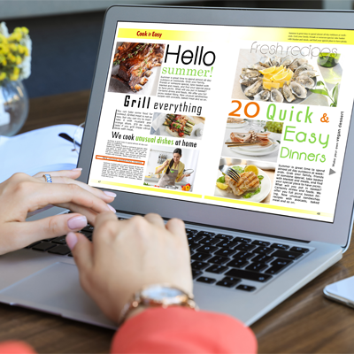 Woman Looking at Online Cooking Magazine on Laptop